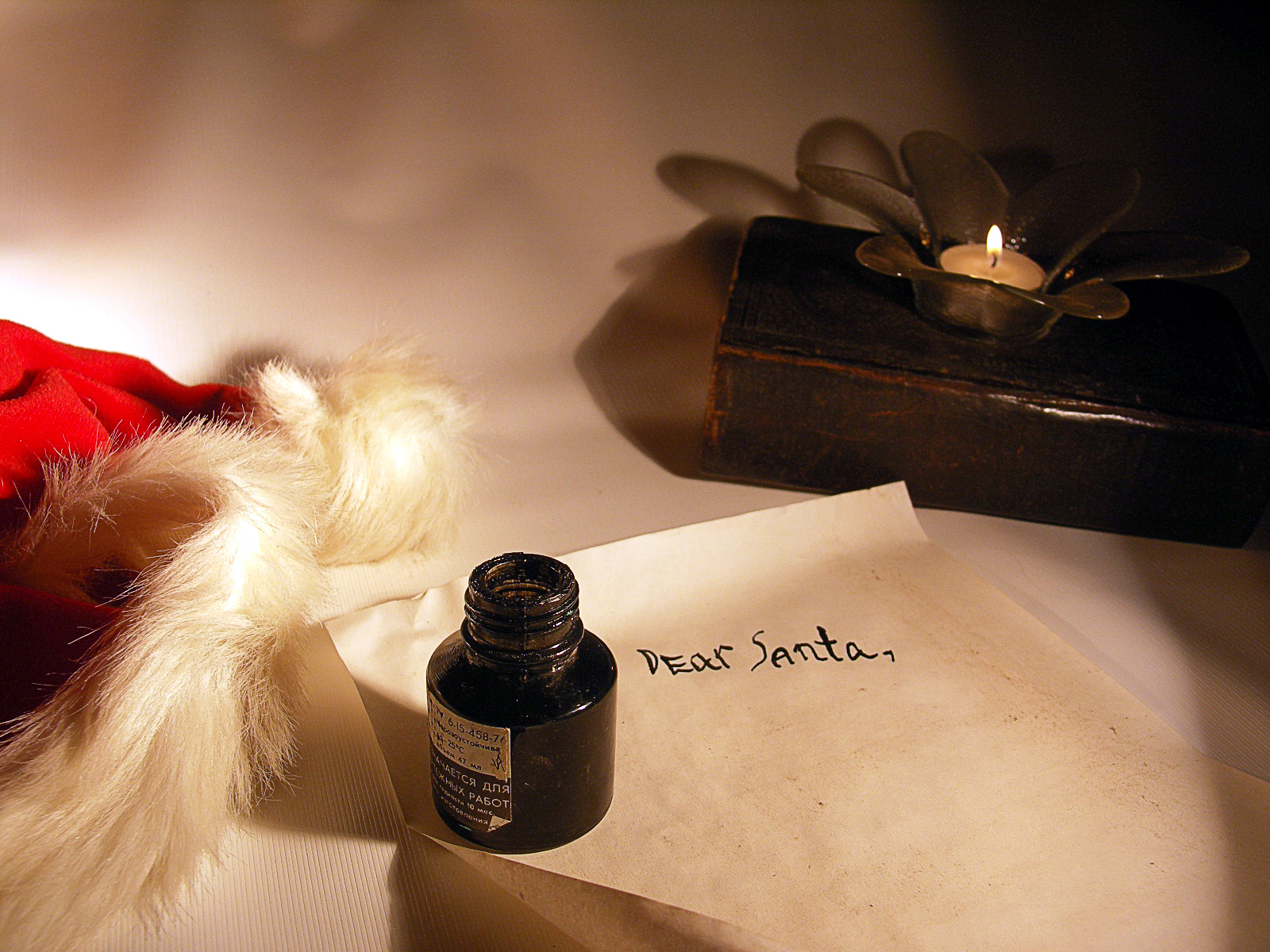 Letter with an ink pot on top for writing to Santa