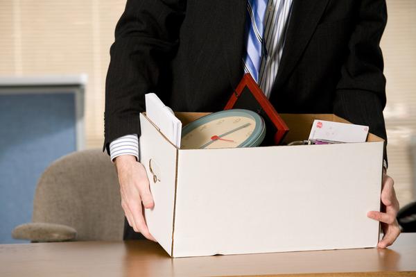 Employee packing his things from work